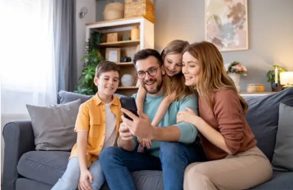 family on the couch looking for homes to buy in Randburg